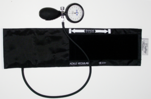 “Analog sphygmomanometer and cuff on a table”