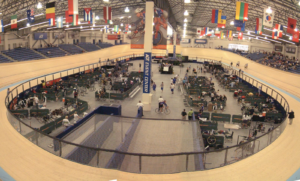 “Indoor cycling track with a rider on a velodrome.”