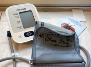 “Automatic upper-arm blood pressure monitor on a table.”
