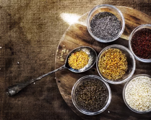 “Bowls of chia seeds and flaxseeds rich in plant-based omega-3 fats”