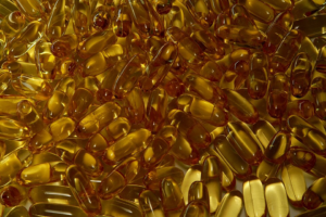 “Pile of translucent fish-oil capsules.”