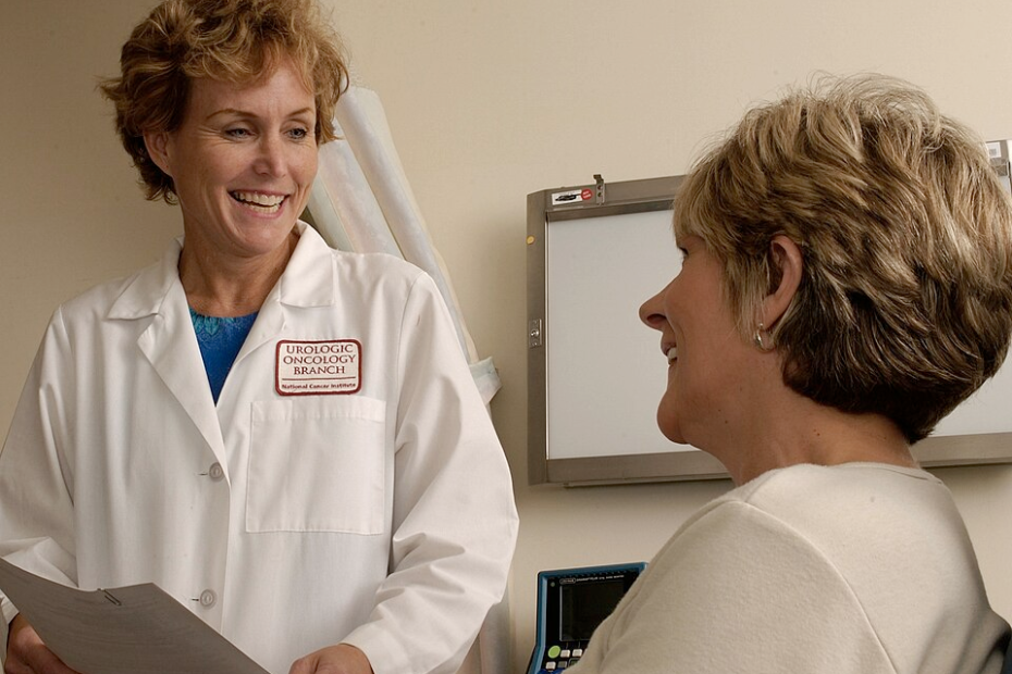 “Doctor consulting with a patient in a clinical setting.”
