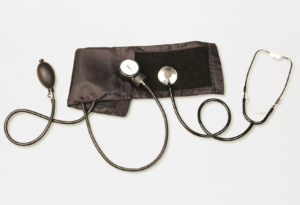 “Close-up of manual blood pressure cuff and gauge.”