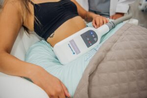 “Patient receiving cryolipolysis (CoolSculpting) non-invasive fat-reduction treatment”