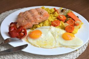 Salmon fillet and egg yolks on a table, rich dietary sources of vitamin D